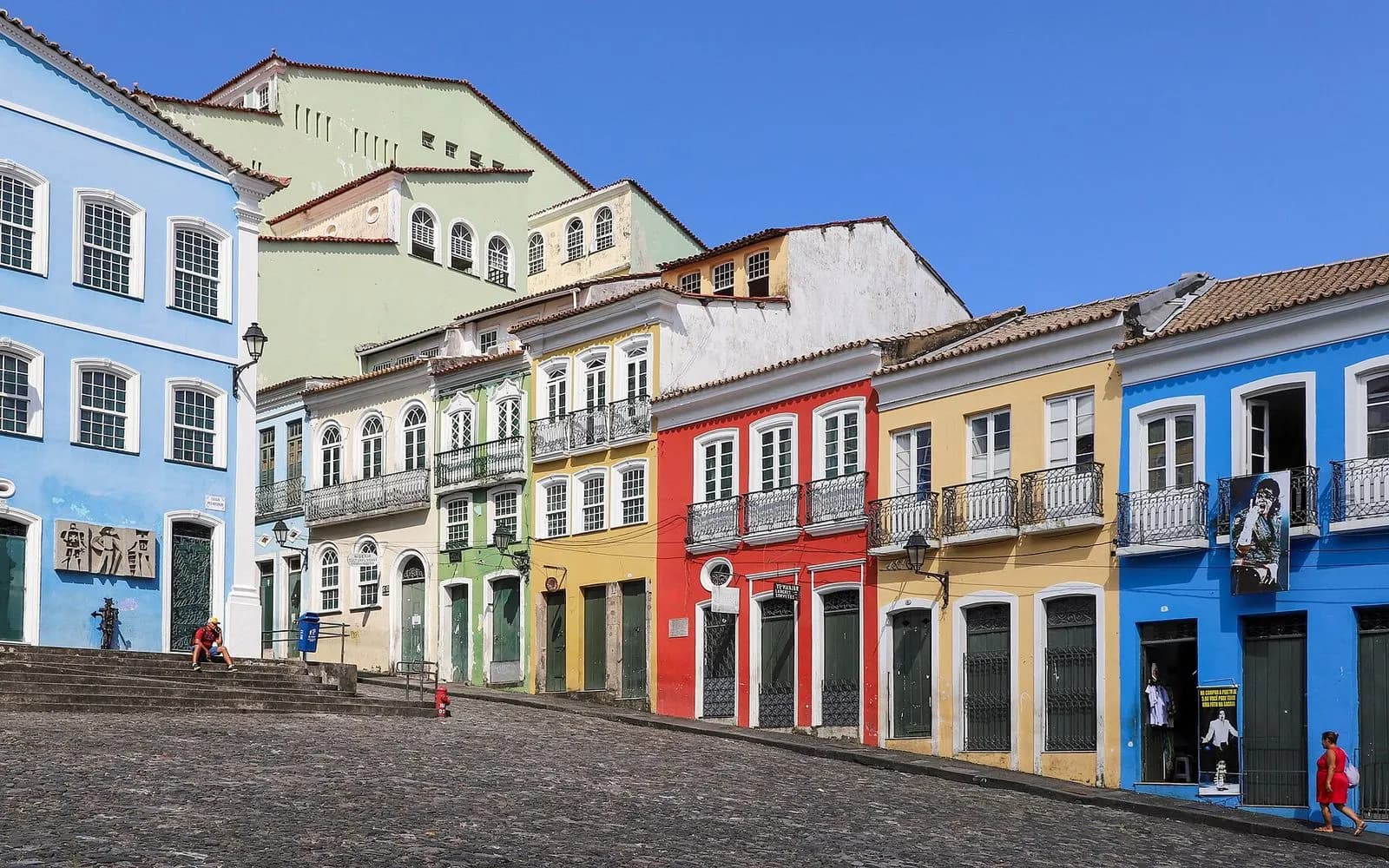 A row of pastel and primary-coloured colonial houses on the Largo do Pelourinho, Salvador, Bahia, Brazil