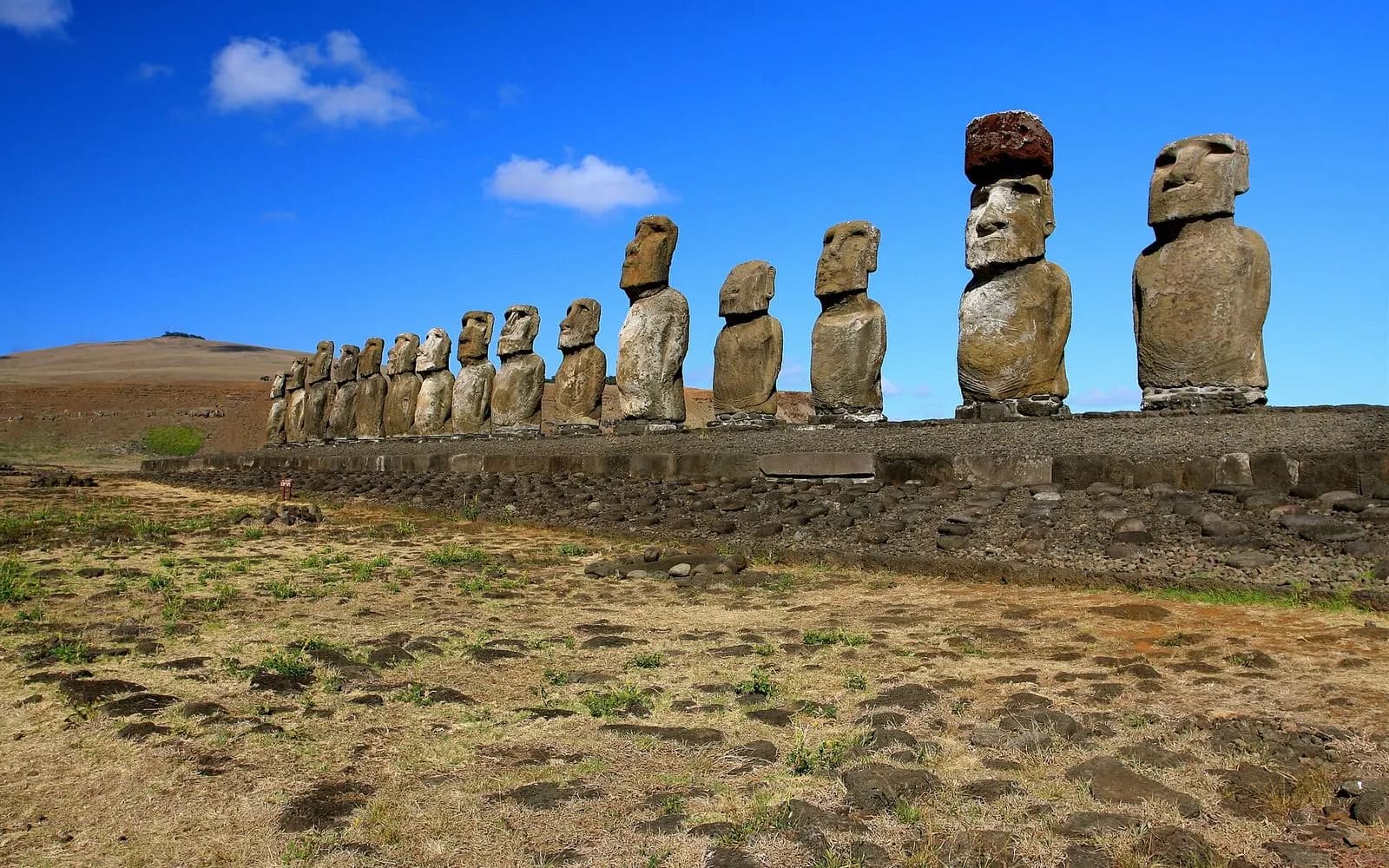 A long row of moai statues on the Ahu Tongariki platform, Easter Island, Chile