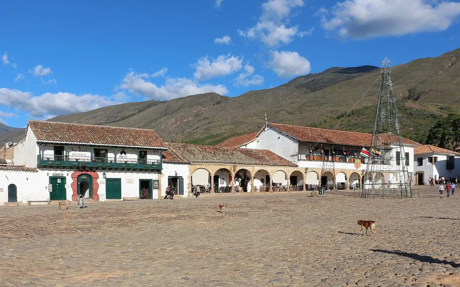 Vast cobbled Plaza Mayor ringed by whitewashed colonial buildings and mountains, Villa de Leyva, Colombia