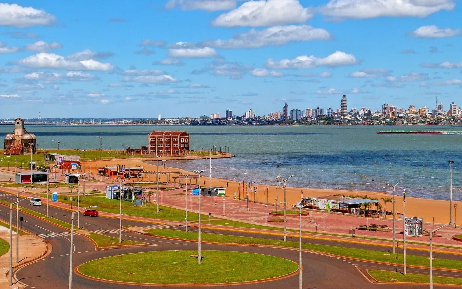 Playa San José beach and costanera beside the Paraná river with Posadas beyond, Encarnación, Paraguay