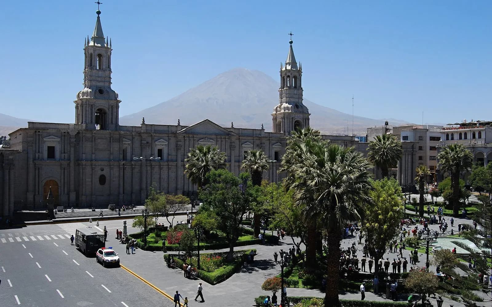 Arequipa cathedral's twin towers and palm-lined Plaza de Armas with Misti volcano behind, Peru